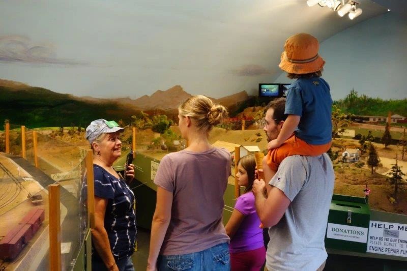 Model railroad town scene with period buildings