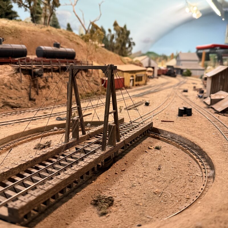 Close view of a turntable bridge and circular pit in the railroad yard