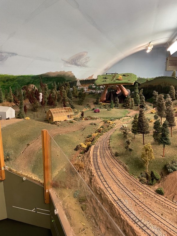 Volunteer working on layout scenery and trackwork