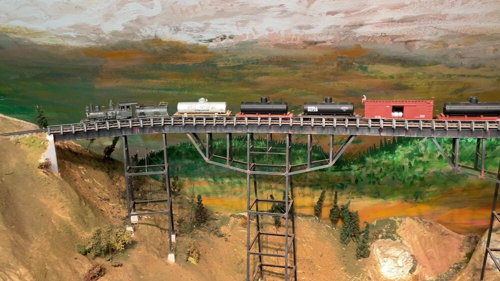 Wide view of locomotive and freight consist on the Bear River Bridge model